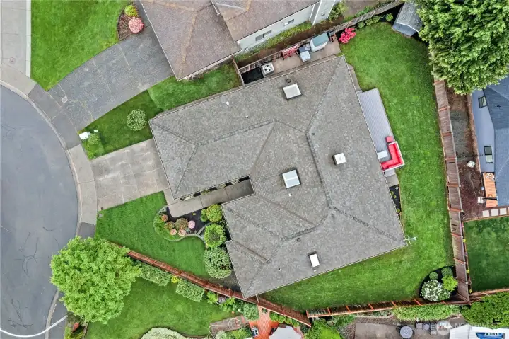 Overhead Lot Perspective  Aerial view showcasing the fully fenced yard, expansive outdoor living spaces, and ideal positioning within the neighborhood.