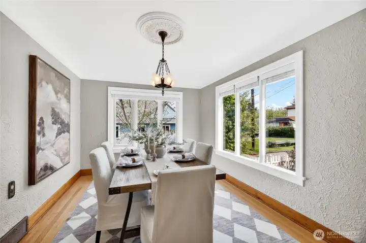 The stunning dining room with period lighting and large windows