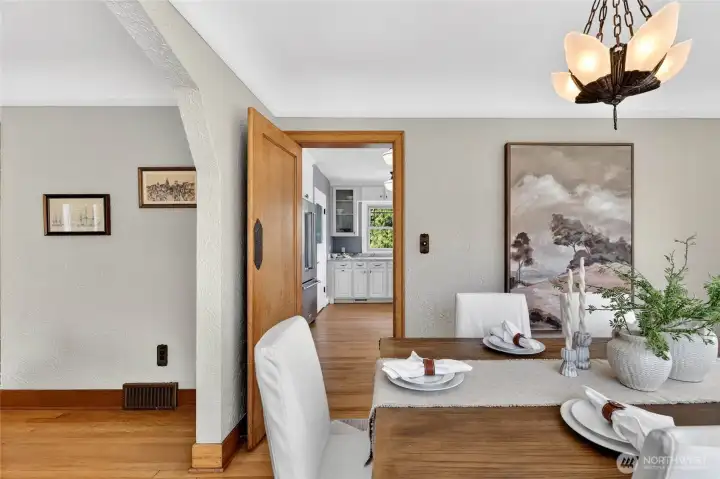 The swing-door leads to the kitchen