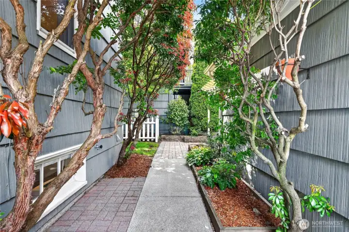 The building to the left is the garage, on the right is the house