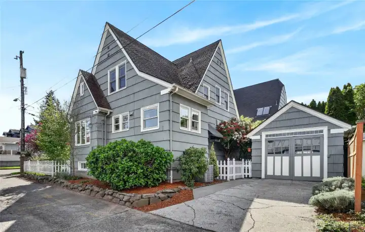 The garage is conveniently located off the alley.  There is also an electric car charger to the left of the driveway