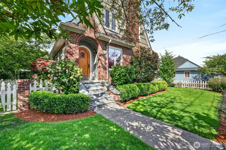 The front yard and the impressive entry to the home