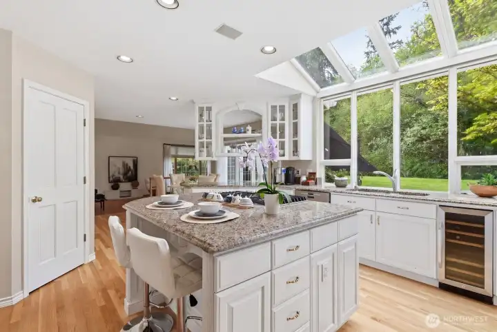 Kitchen with wine fridge and 5 burner gas stove