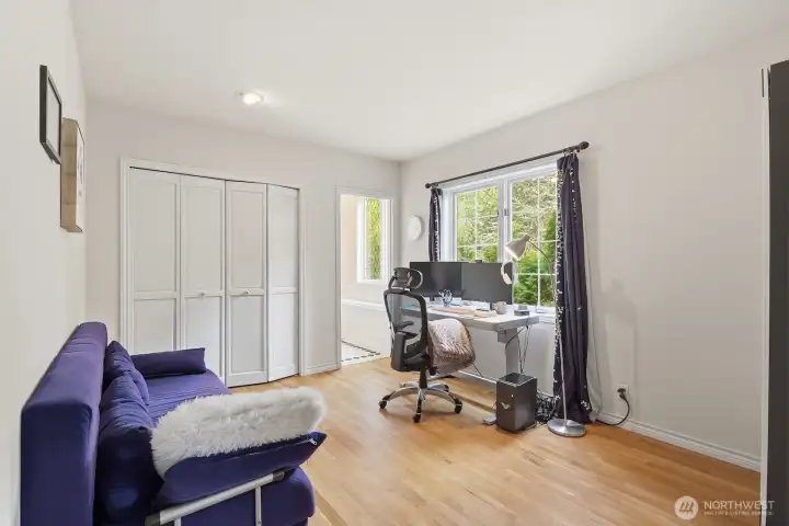 An additional main-floor bedroom with en-suite bath—perfect for guests or multigenerational living