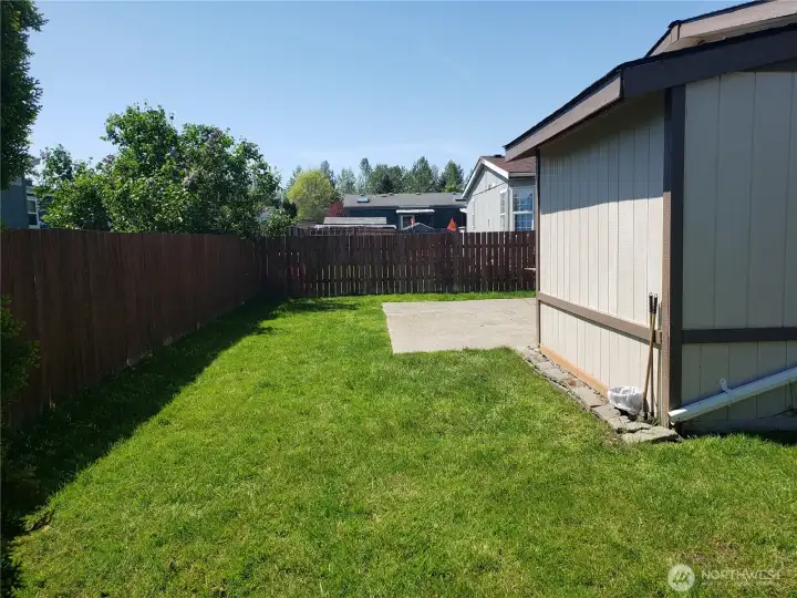 An Opposite Picture of the Spacious Pet Friendly Fully Fenced Back Yard.