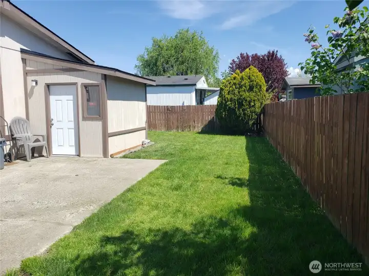 Another Picture of the Spacious Pet Friendly Fully Fenced Backyard Showing Dry Storage Shed.