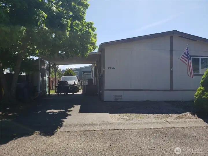 Another Picture of the Front of the Home Showing Room For 2-3 Vehicle Parking with Carport.