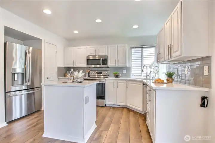 Updated kitchen with newer appliances and quartz counters