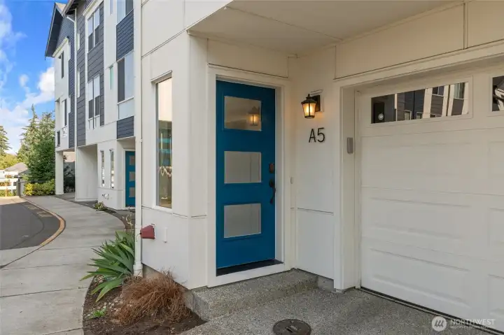 Come home to a welcoming entrance and a striking blue front door that sets the tone for elevated living within. Come home to a welcoming entrance and a striking blue front door that sets the tone for elevated living within.