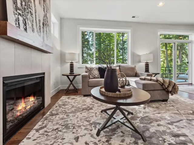 Family room invites natural light with picture windows