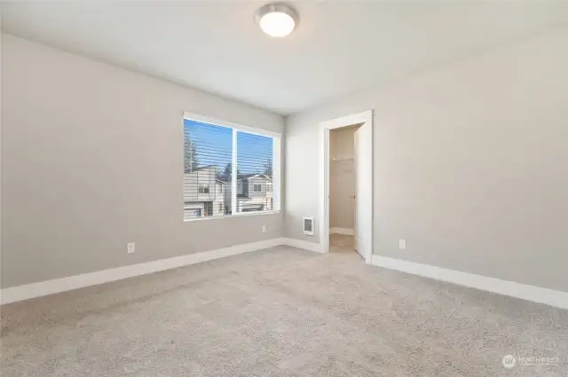 Bedroom with walk-in closet.