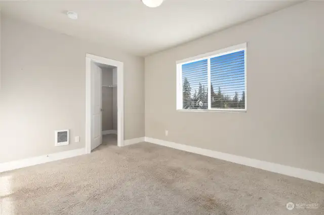 Bedroom with walk-in closet.