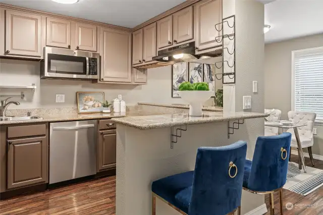 View of kitchen with breakfast bar.