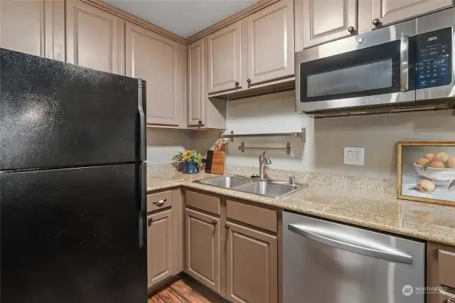 Another view of kitchen showing inner corner of counter and cabinets.