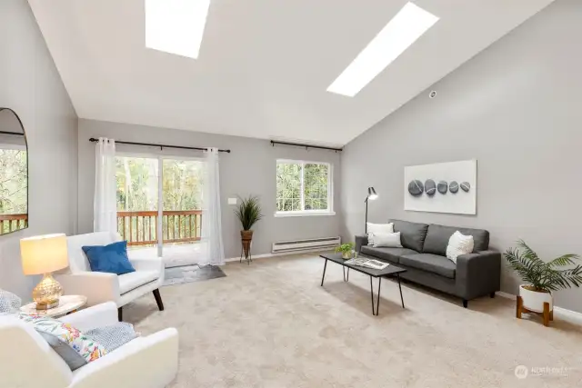 Great room with skylights and vaulted ceiling