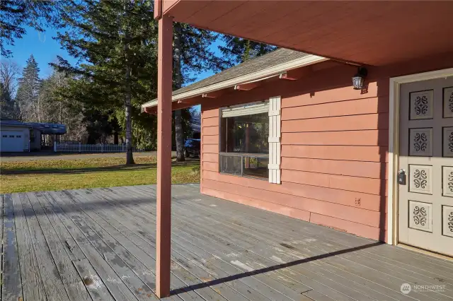 This large deck is a great place to entertain guests or just relax and enjoy the outdoors. It has easy access to the side door of your home.