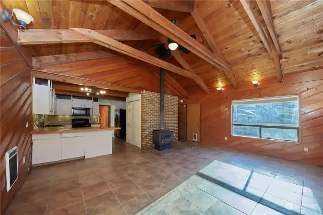 This home has high loft ceilings with open wood beams and natural wood finishes. The ceilings add a lot of character to the home.