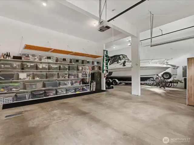 Oversized garage with custom storage shelving and 36' RV/Boat garage