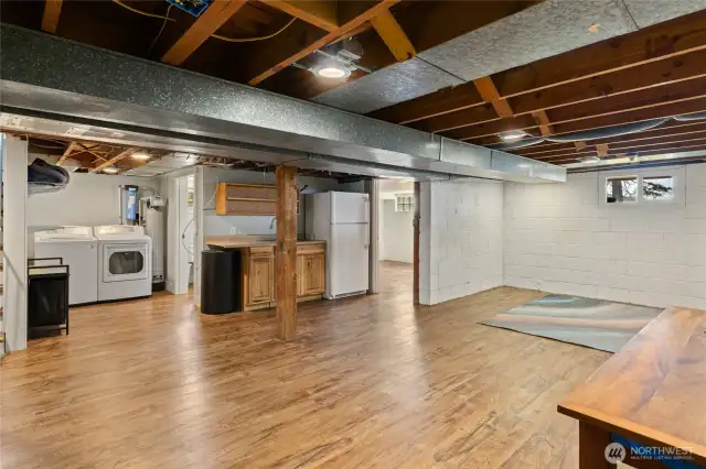 Basement with laundry room and partial kitchen.