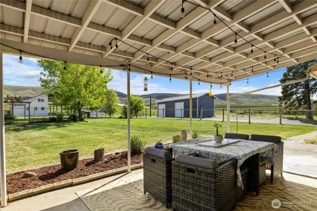 Covered back deck perfect for an morning coffee or evening BBQ.
