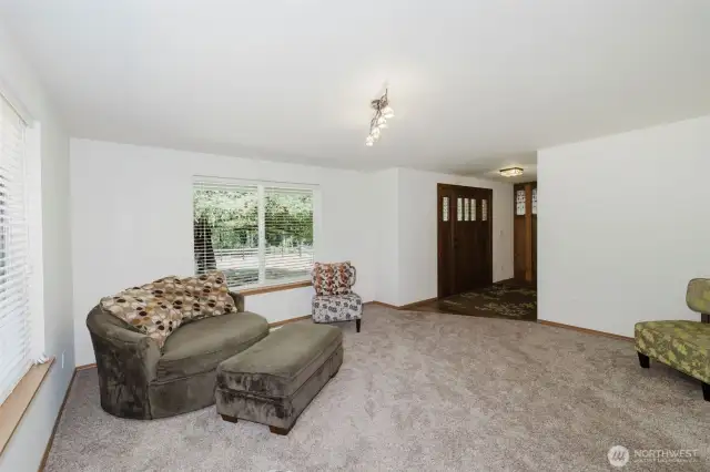 Living room just off the foyer with tons of natural light.