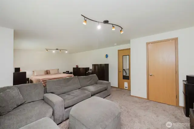 Massive bedroom upstairs.  Original home design were for a 4 bedroom house, so Sellers decided to make 2 bedrooms into one.  Walk-in closet and plenty of natural light from the eastern facing windows.