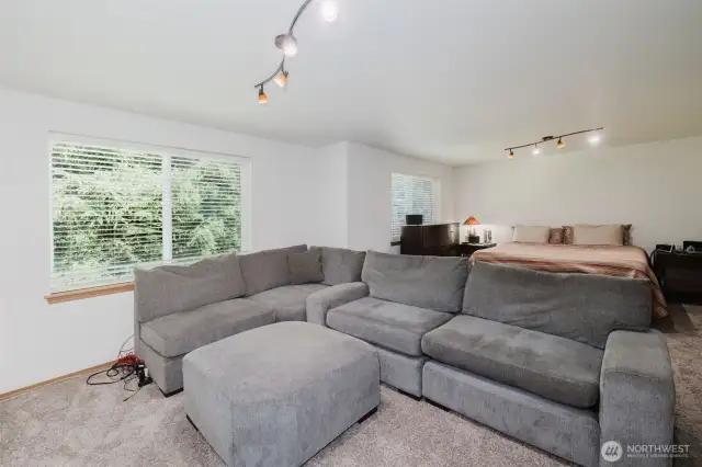 Full size sectional fits in one half of this bedroom which also includes a king size in the background.  This room is SO BIG!