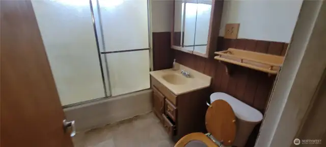 Full bath in hallway on the main floor.
