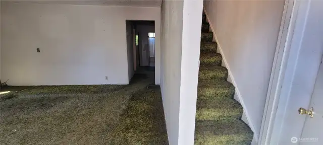 stairs off entry to upper floor.