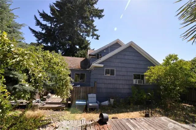 Deck and back yard with fruit trees.