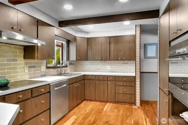 Bright and functional kitchen with canned lighting and plenty of cabinet space.