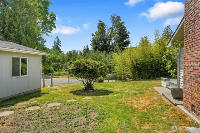 This portion of the backyard is fully fenced.