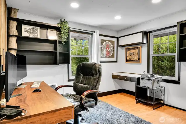 Bedroom #2 with large windows and built-in shelving.