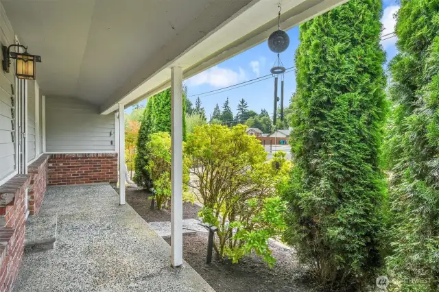 Covered front patio is perfect for morning coffee.