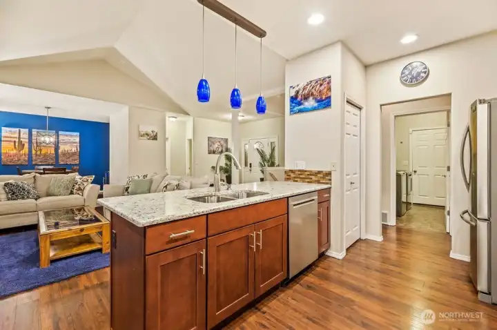Plenty of workspace on granite countertops, newer dishwasher