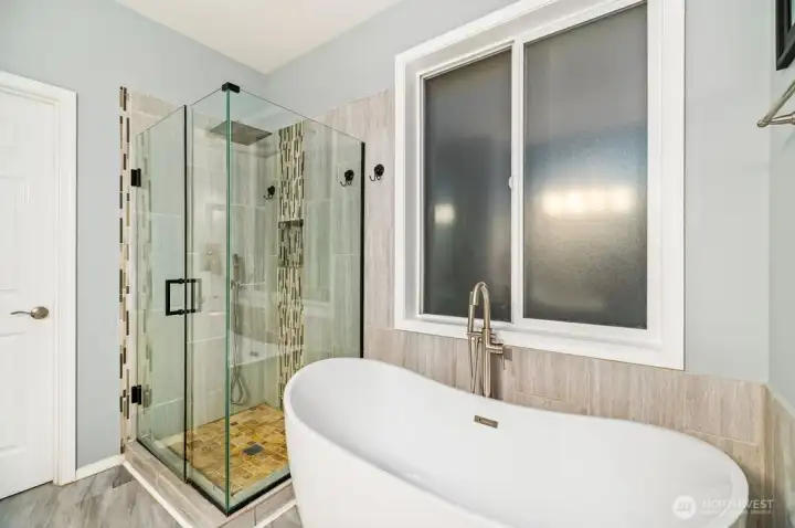 Luxury tile surround shower with rain shower head plus handheld sprayer