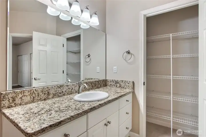 Primary bath features lots of storage.