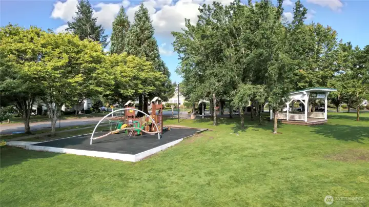 Playground and park across the street.
