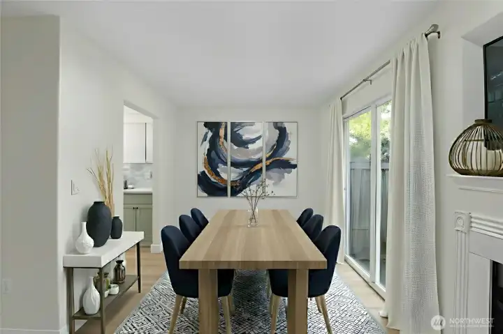 Dining area off kitchen with updated flooring and open layout—ideal for everyday living in Everett 3-bedroom townhome. virtually staged