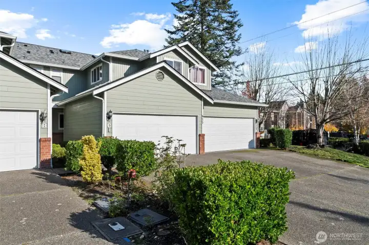 In-home laundry area offering convenience and storage in updated Everett townhome