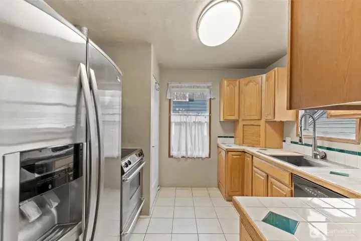 Kitchen with plenty of cabinets and eating area.