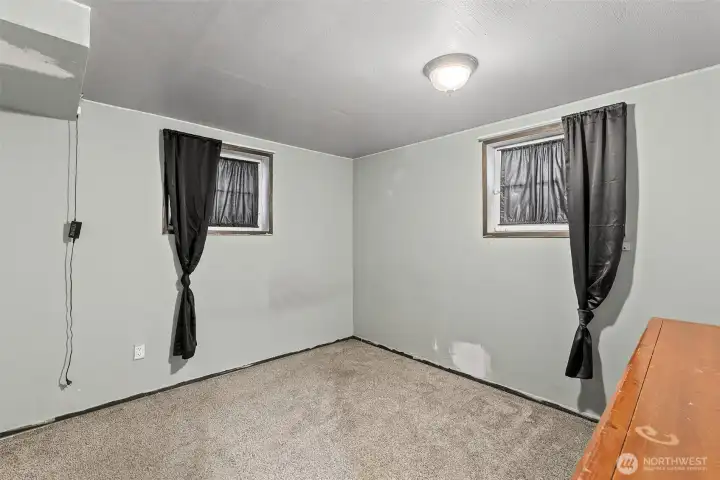 Large downstairs bedroom with egress windows.