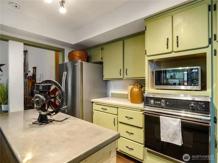 Soft green painted cabinets adds to the charm.