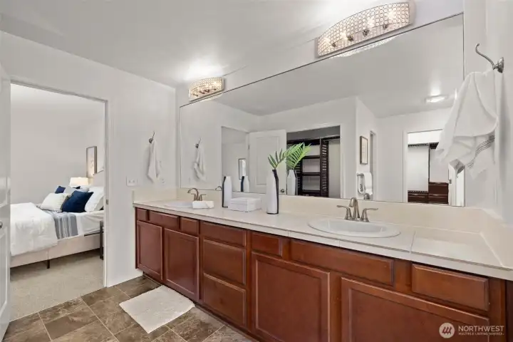 Dual vanities in the primary suite bathroom