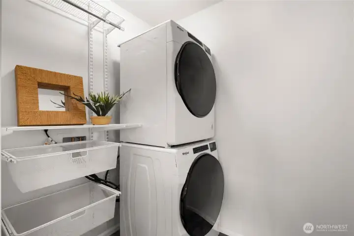 Upstairs laundry off of the primary suite, with Elfa shelving from The Container Store (the garage also has an upgraded Elfa system)
