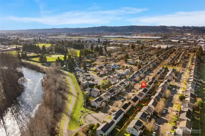 You're just 5 homes away from the trail (and no flood plain - buyer to verify)