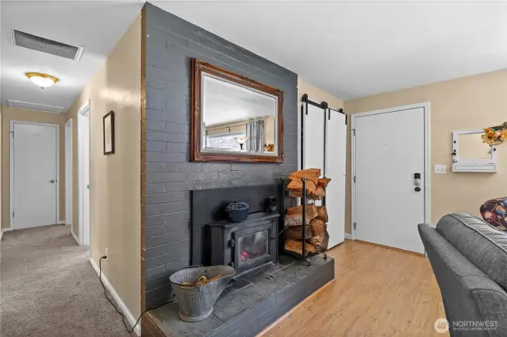 The wood burning fireplace can heat the entire house in the winter and features an electric fan to disburse the heat.