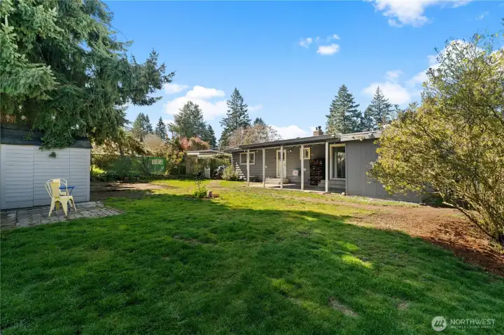 Alongside the garden shed is a concrete pad perfect for a bistro dining set.