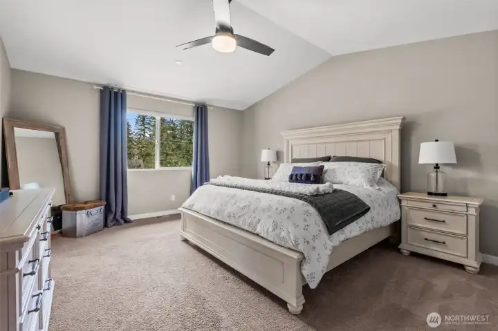 High ceilings and lots of space, this primary bedroom is a dream come true.