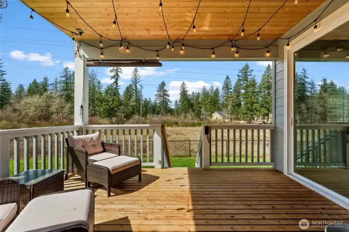 Venture outside through the two sliding glass doors located on the main floor to this beautiful covered patio deck!